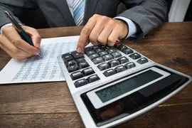 5953080_stock-photo-businessperson-doing-calculation-in-office.jpg