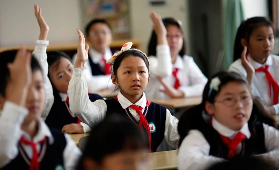 Young-Pioneers-attend-class-after-the-weekly-flag-raising-ceremony-at-the-East-Experimental-School-in-Shanghai-November-5-2012.-Created-in-1949-the-Young-Pioneers-movement-is-considered-a-seedbed-for-future-members.jpg