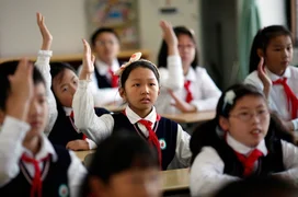 Young-Pioneers-attend-class-after-the-weekly-flag-raising-ceremony-at-the-East-Experimental-School-in-Shanghai-November-5-2012.-Created-in-1949-the-Young-Pioneers-movement-is-considered-a-seedbed-for-future-members.jpg