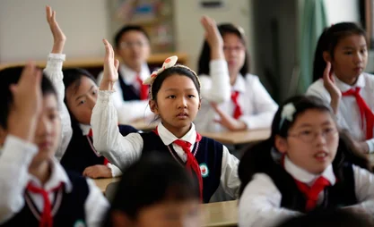 Young-Pioneers-attend-class-after-the-weekly-flag-raising-ceremony-at-the-East-Experimental-School-in-Shanghai-November-5-2012.-Created-in-1949-the-Young-Pioneers-movement-is-considered-a-seedbed-for-future-members.jpg