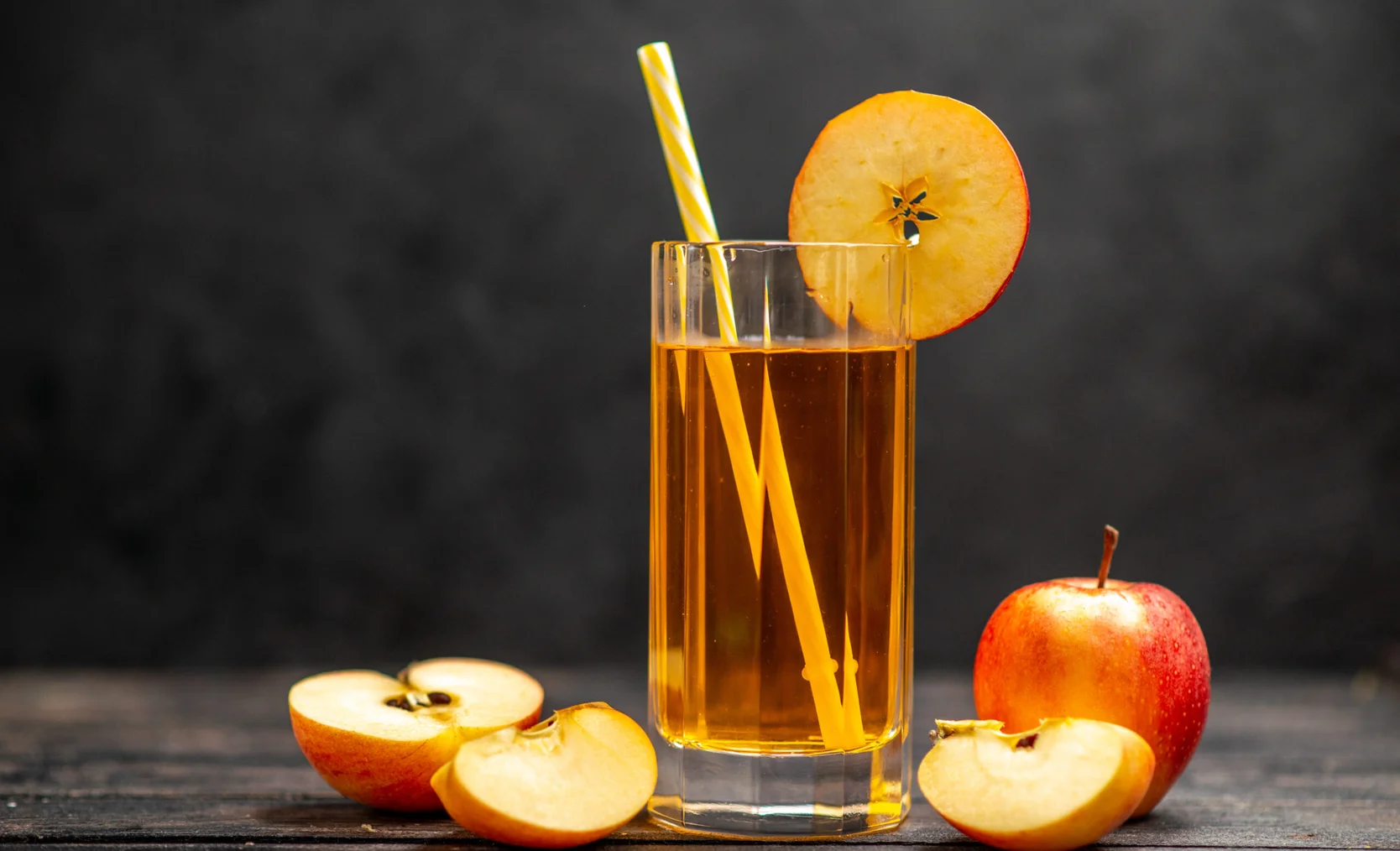front-view-of-fresh-natural-delicious-juice-in-two-glasses-with-red-apple-limes-on-black-background-scaled.jpg