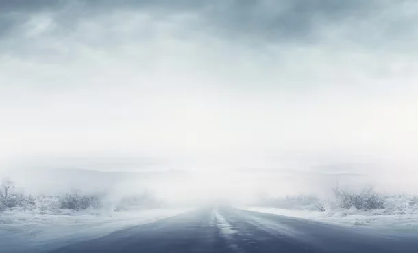 snowy-road-disappears-into-foggy-winter-landscape_157027-4463.avif